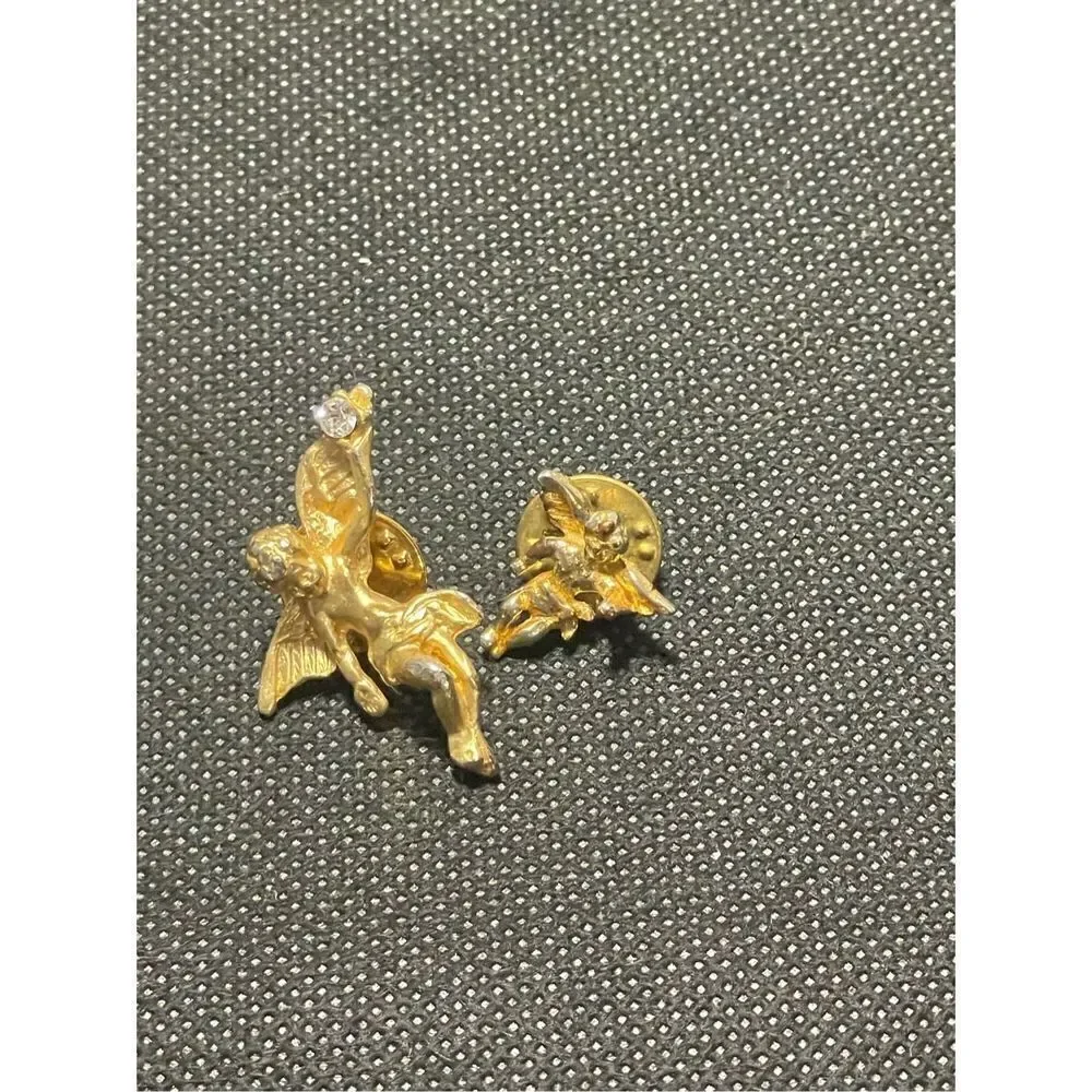 Two cherub pins￼